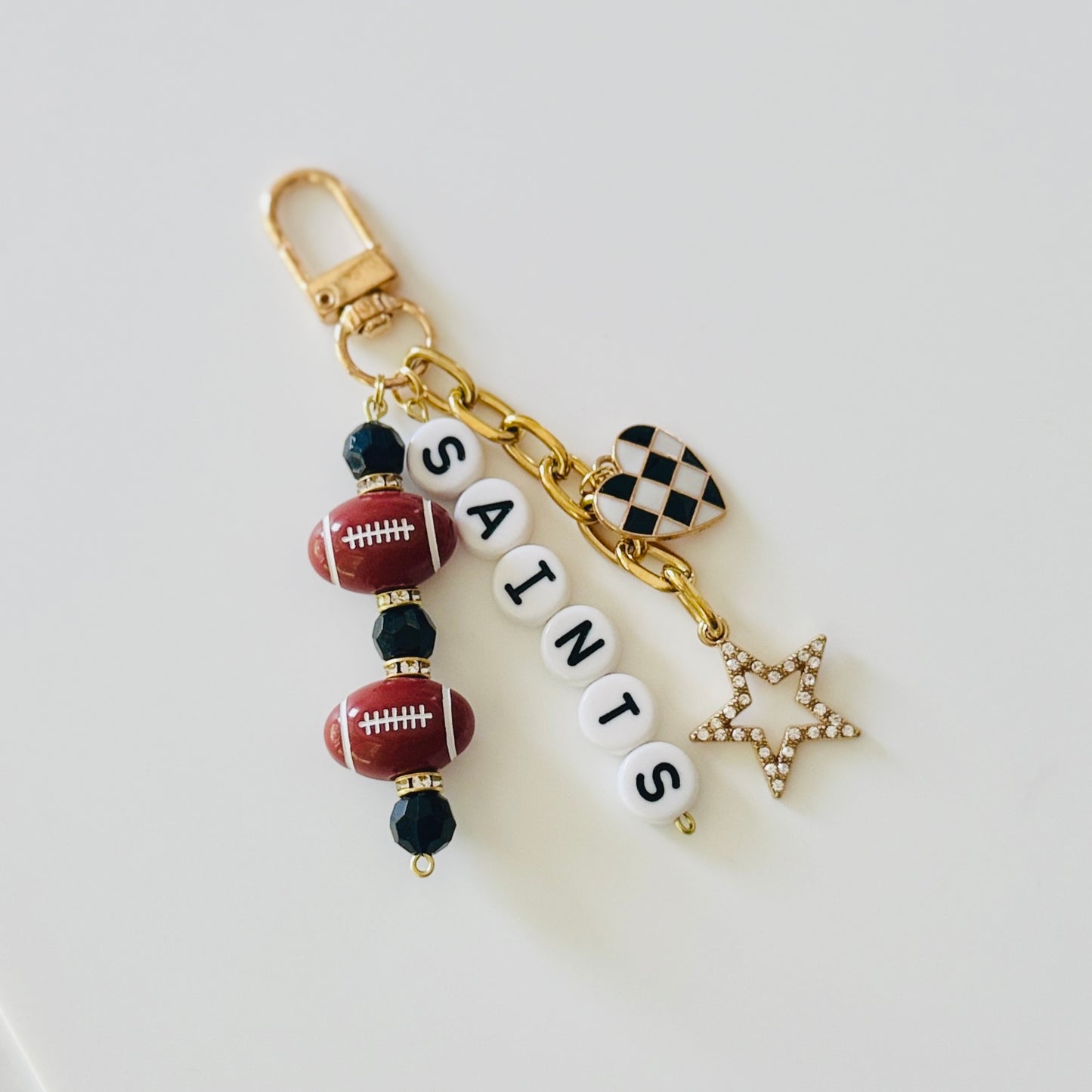 Saints Football Beaded Keychain: Gold Bag Charm with Enamel Heart and Star