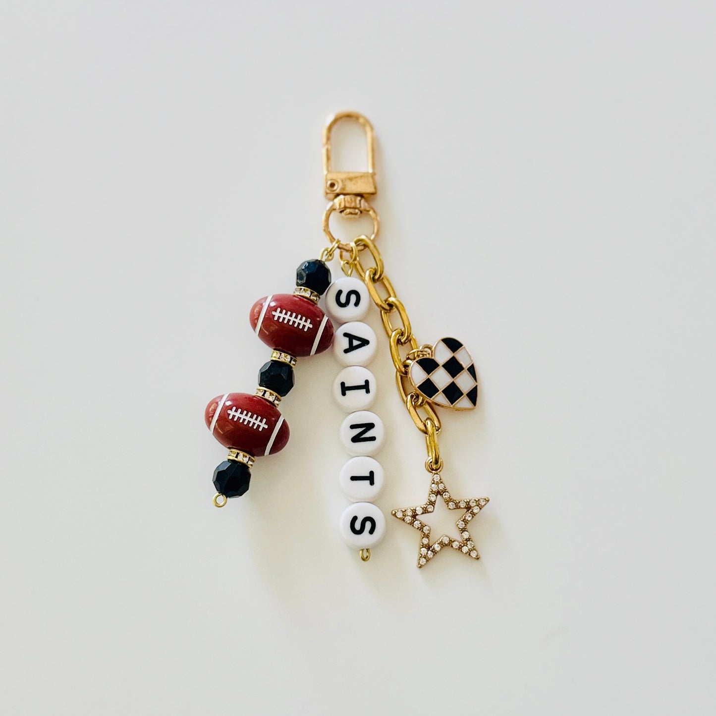 Saints Football Beaded Keychain: Gold Bag Charm with Enamel Heart and Star