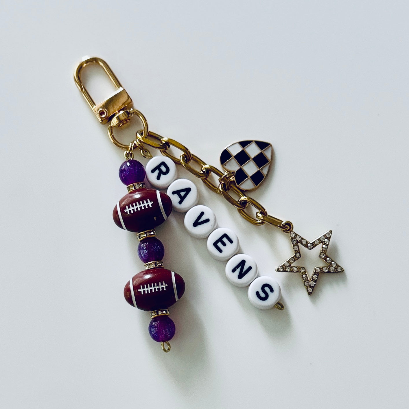 Ravens Football Beaded Keychain: Gold Bag Charm with Enamel Heart and Star