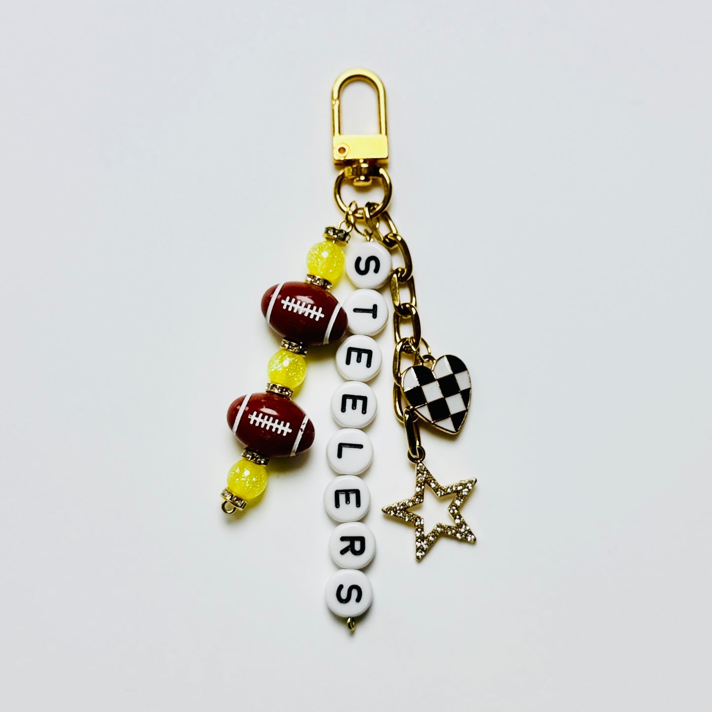 Steelers Football Beaded Keychain: Gold Bag Charm with Enamel Heart and Star
