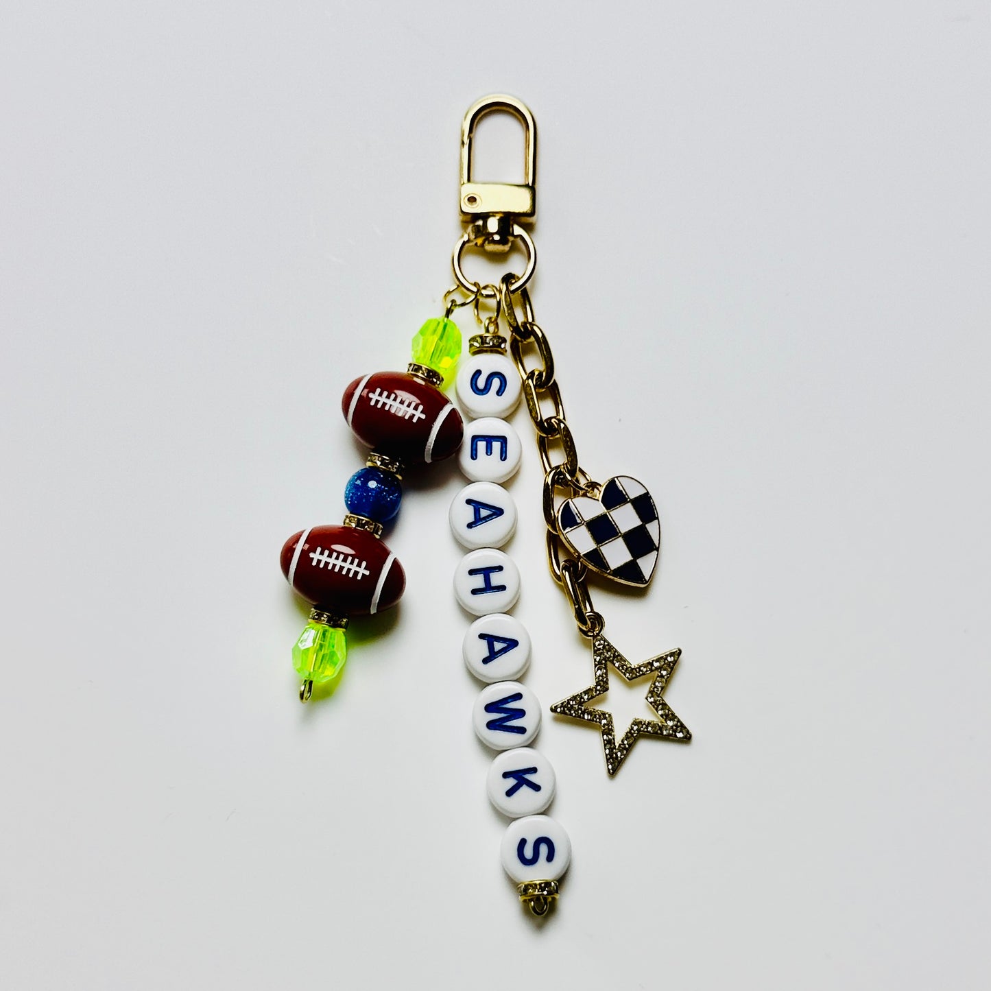 Seahawks Football Beaded Keychain – Gold Bag Charm with Letter Beads, Football Beads, & Enamel Heart