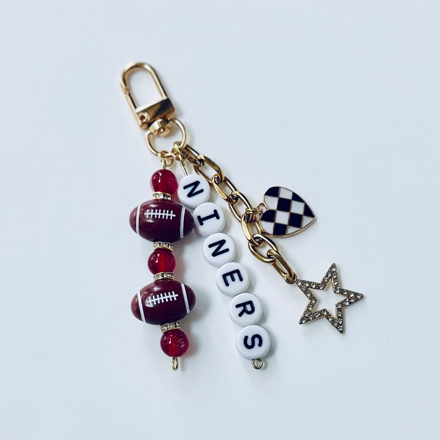 Niners Football Beaded Keychain: Gold Bag Charm with Enamel Heart and Star