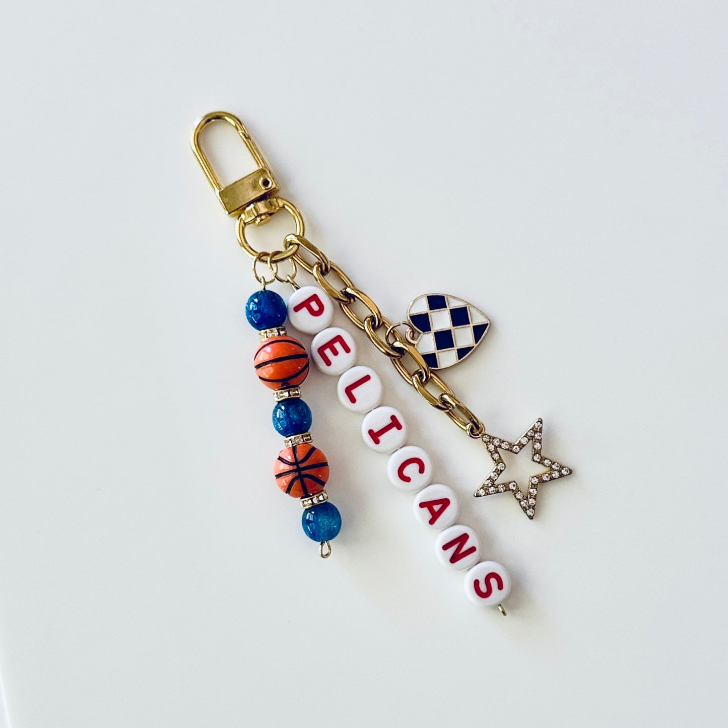 Pelicans Basketball Keychain – Gold, Blue & Red Beaded Keychain with Star and Heart Charms