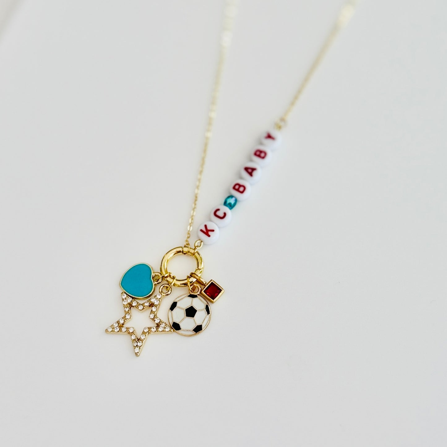 KC Baby Charm Necklace – Kansas City Soccer Ball + Teal & Red Letter Beads on Gold Chain