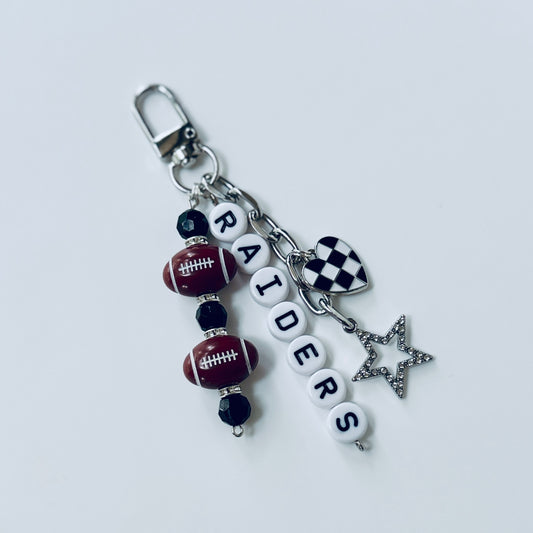 Raiders Football Beaded Keychain: Silver Bag Charm with Enamel Heart and Star