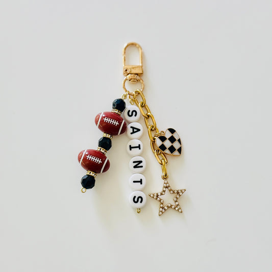 Saints Football Beaded Keychain: Gold Bag Charm with Enamel Heart and Star