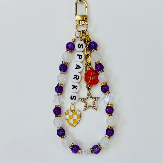 Sparks Women’s, Purple, Yellow, White Basketball Bag Charm – 6.5” Handmade Beaded Keychain with Charms, Sports Bag Accessory, Resin Beads
