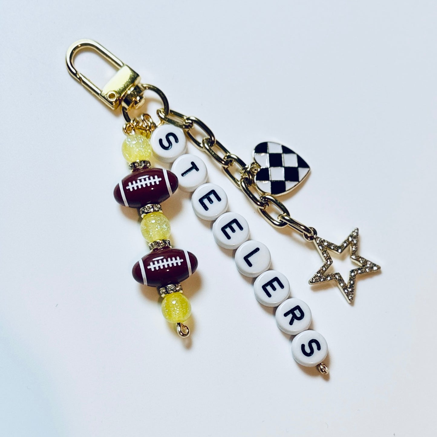 Steelers Football Beaded Keychain: Gold Bag Charm with Enamel Heart and Star
