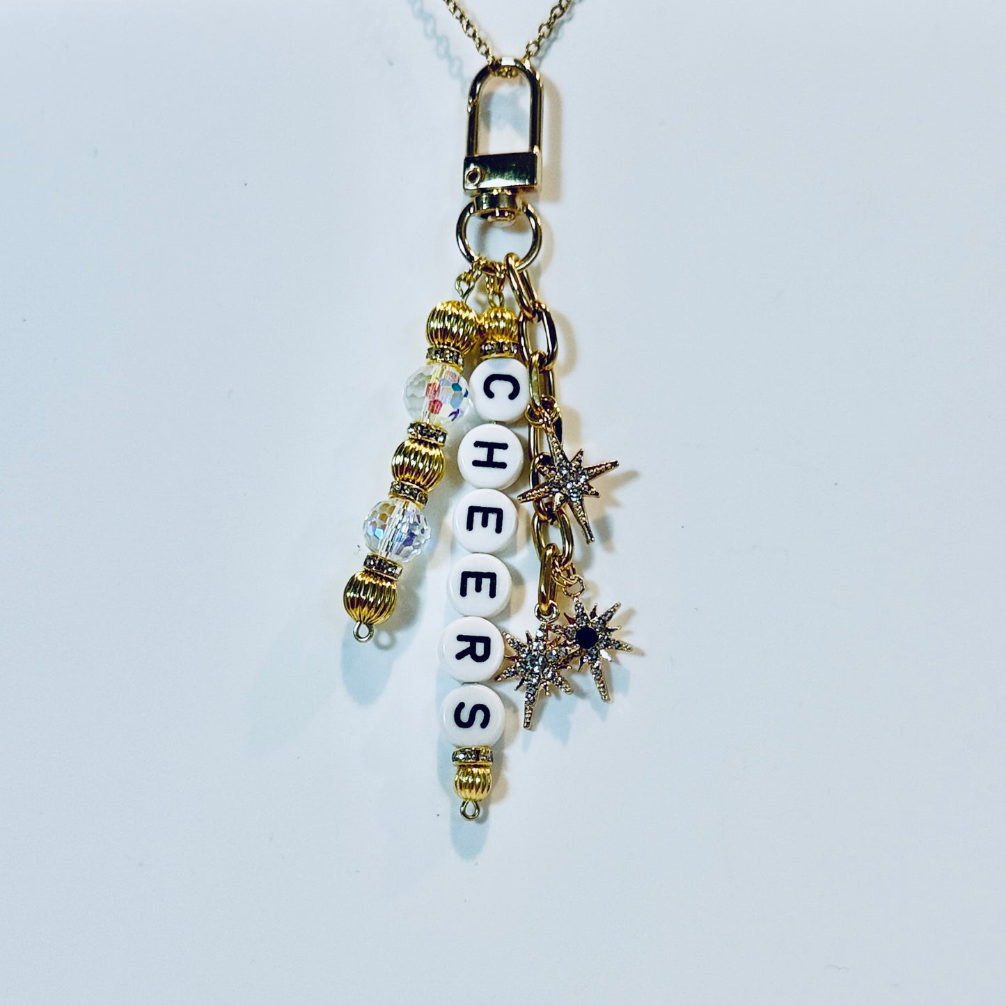 Cheers Bag Charm: Black and Gold Holiday Keychain