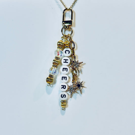 Cheers Bag Charm: Black and Gold Holiday Keychain