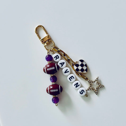 Ravens Football Beaded Keychain: Gold Bag Charm with Enamel Heart and Star