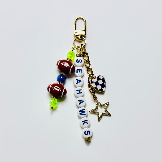 Seahawks Football Beaded Keychain – Gold Bag Charm with Letter Beads, Football Beads, & Enamel Heart