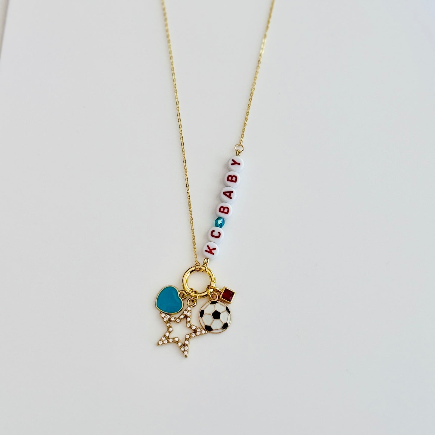 KC Baby Charm Necklace – Kansas City Soccer Ball + Teal & Red Letter Beads on Gold Chain